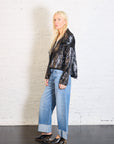 Cropped Asymmetrical Jacket in Crushed Patent Black by Planet-Planet-Idlewild-Cincinnati
